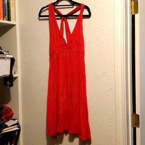 Flowy open backed red cotton dress.